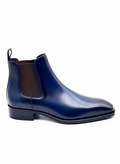 A pair of navy blue patent leather Chelsea boots with a sleek profile and a traditional Italian Belgravia toe.